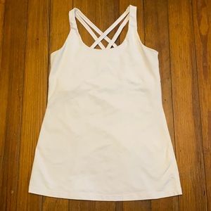 Women’s white athletic tank top with built in bra.